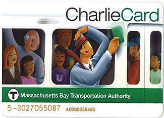 This is a picture of the Massachusetts Bay Transportation Authority CharlieCard for the T system. It is a rectangular card with an illustration of people riding in a subway car, and a man in a blue suit holding up a green item. CharlieCard is written in the upper right corner in black and green. A green strip with the T logo and Massachusetts Bay Transportation Authority written in white appear on the lower portion of the card. At the bottom of the card is a serial number.