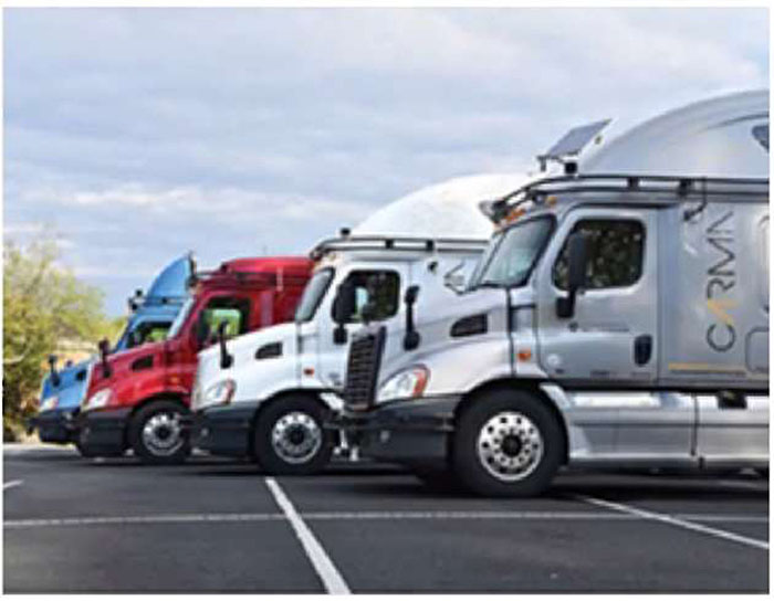 Stock photo of several commercial freight trucks parked next to each other