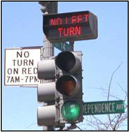 On the left side of the slide an image of traffic signal Head with a No Left Turn message sign is shown-as a Blank out sign.