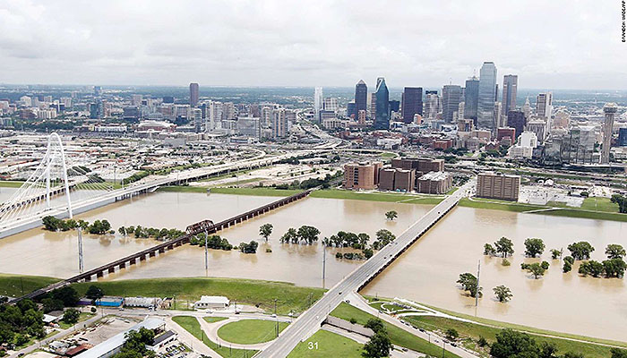 Authors relevant description: A photo of flooded roadway is shown.