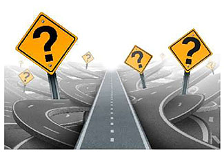 An image that depicts a roadway with yellow diamond warning signs on either side that each display a question mark.