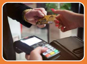Author's relevant description: A picture of a customer handing a credit card to a clerk at a point-of-sale terminal. The graphic is intended to represent procurement.