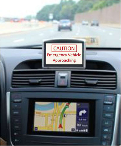 This slide includes a picture of an in-vehicle display that is warning the driver of an approaching emergency vehicle; this is one example of a vehicle-to-vehicle application.