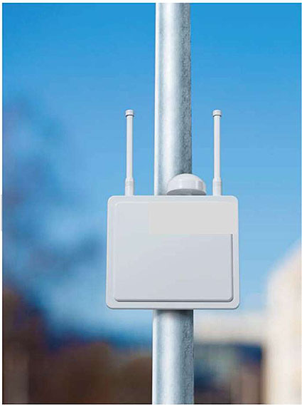 Photo of an RSU mounted on a vertical metal pole.