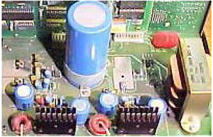 This slide shows a photo of a power supply module in the lower right.