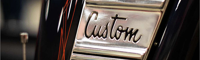 This slide includes a graphic of a car center console with a chrome button labeled with the word “Custom”.