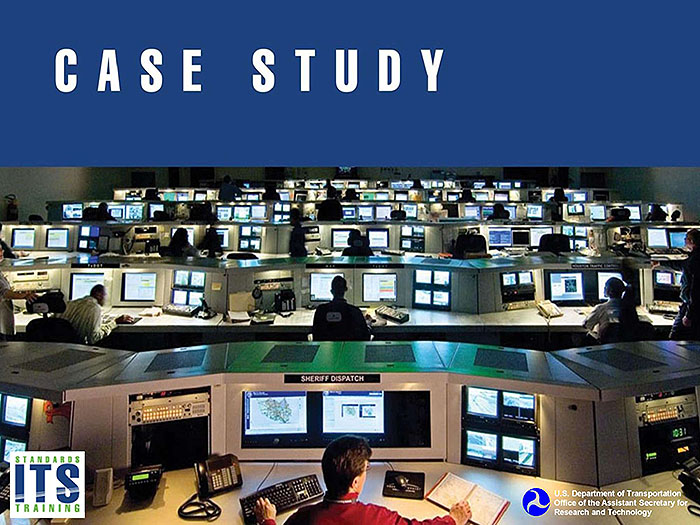Case Study. A placeholder graphic of a traffic operations center indicating a case study. The image shows a large room with a series of computer work stations in six visible rows leading into the distance. People are seated and working at several workstations. There is a blue rectangle at the top of the image of the traffic operations center with the title "Case Study." DOT and RITA logo in lower left corner and Standards ITS Training logo in lower right corner.