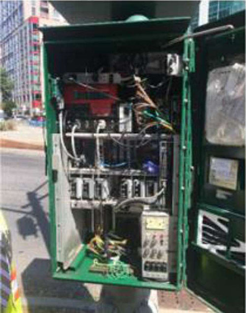A photo of the RSE installation is shown on the right side of the slide. It is a green cabinet with door open to show internal parts.
