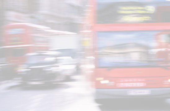 Background image - faded photo of a red, double-decker bus moving in traffic.