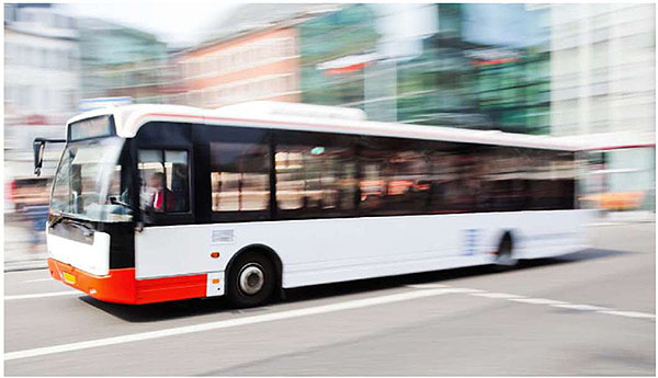 Photo of a transit bus moving to the left.