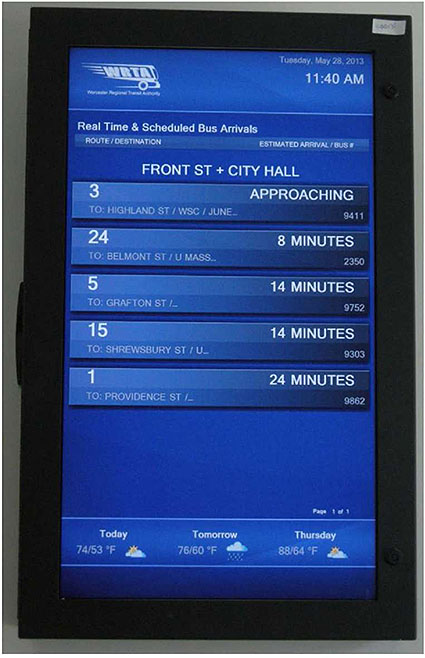 Example photo of a real-time transit information sign that shows the arrival times of buses at the Front St. and City Hall stop.