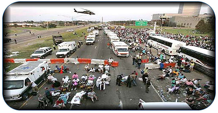 This slide contains a photograph of the September 1st refugee evacuation after Hurricane Katrina. Ambulances are lined up on one side of an interstate highway while buses and people are camping on the other side of a highway.
