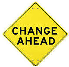A yellow diamond shaped graphic like a traffic sign in the lower right corner contains the words Change Ahead.