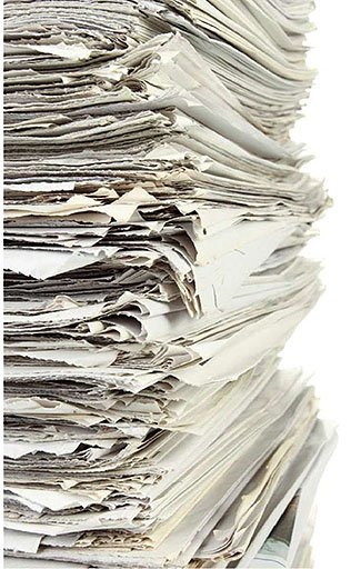 This slide shows a pile of papers on the left.