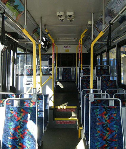 A photo of the empty interior of a bus.