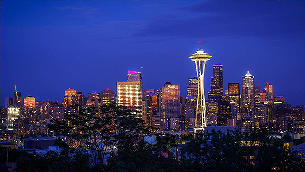 A photograph of the skyline of Seattle, Washington at night. Image Source: thinkstock.com