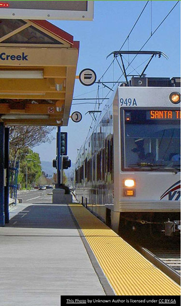 On the left-hand side there is a picture of a transit light-rail train arriving at a station.