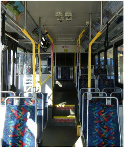 To the right of the bullets is a photo of the interior of a bus in the direction of the back of the bus.