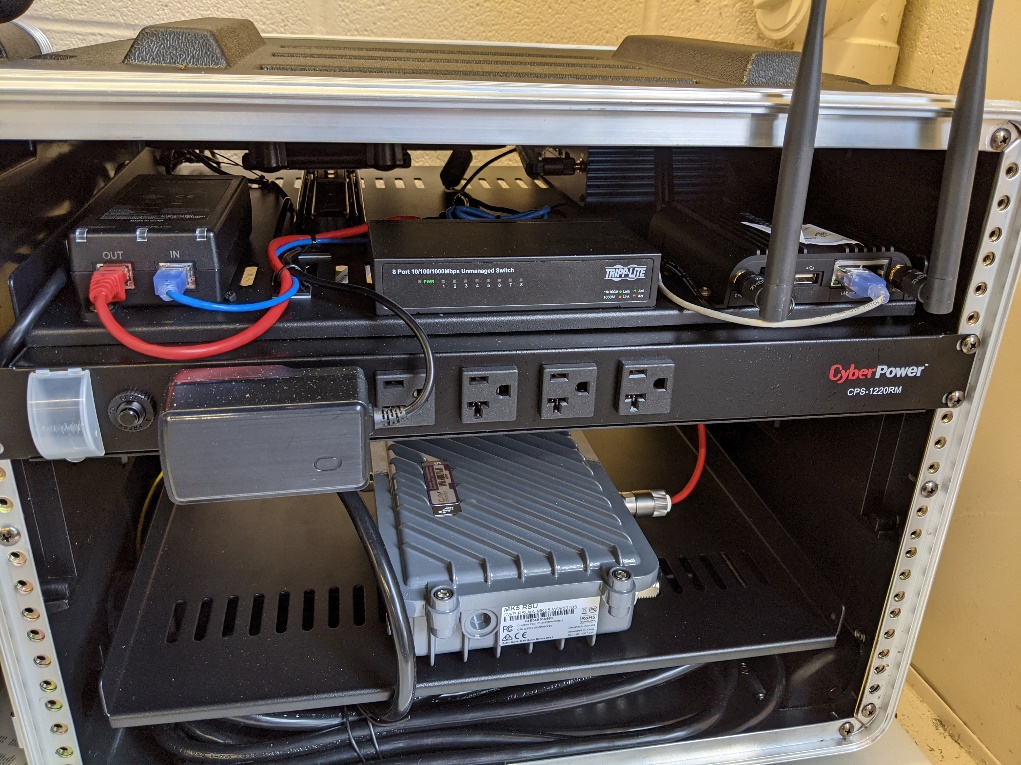 This photo shows the power strip mounted below the upper shelf in Connected and Automated Vehicle education (CAVe)-in-a-box.
