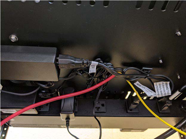 This photo shows an example of cable organization underneath the bottom of the upper shelf of Connected and Automated Vehicle education (CAVe)-in-a-box.
