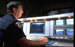 photo of an officer staffing a terminal at a control center