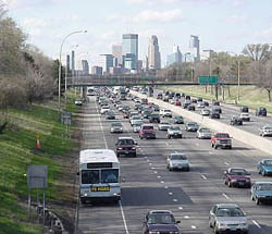 photo of moderate traffic running in both directions on a highway