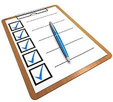 Along the right edge, center of the slide, there is a clip art graphic of a checklist, with boxes checked off and a pen.