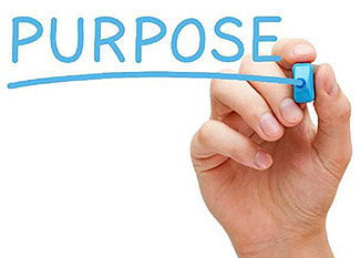 The lower right corner of this slide includes an image of a hand writing the word “Purpose” with a light blue marker.