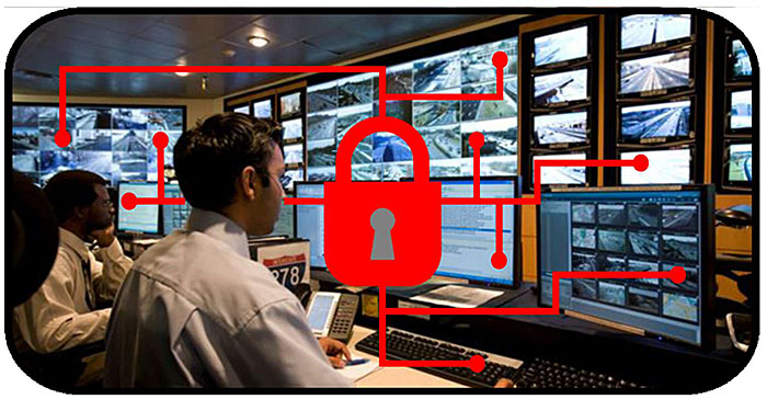 This slide contains one photo showing a traffic management center with an operator at a workstation and with a video wall in the background.  Superimposed upon the photo are a key padlock symbol and some network symbols indicating cybersecurity for systems and networks.